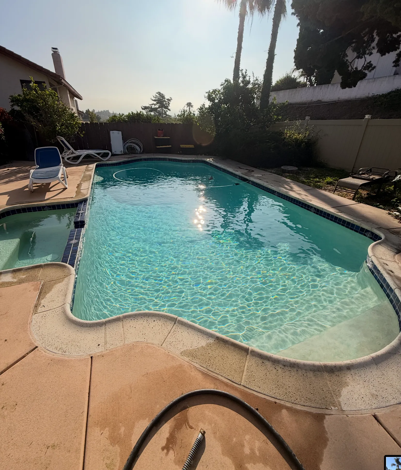 Clean pool and spa with blue tile